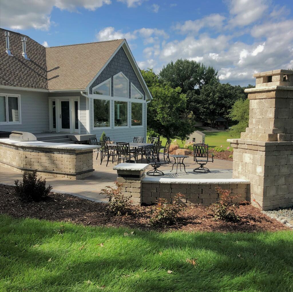 Backyard patio, pavers, benches, seating, fireplace by Sequoia Landscape