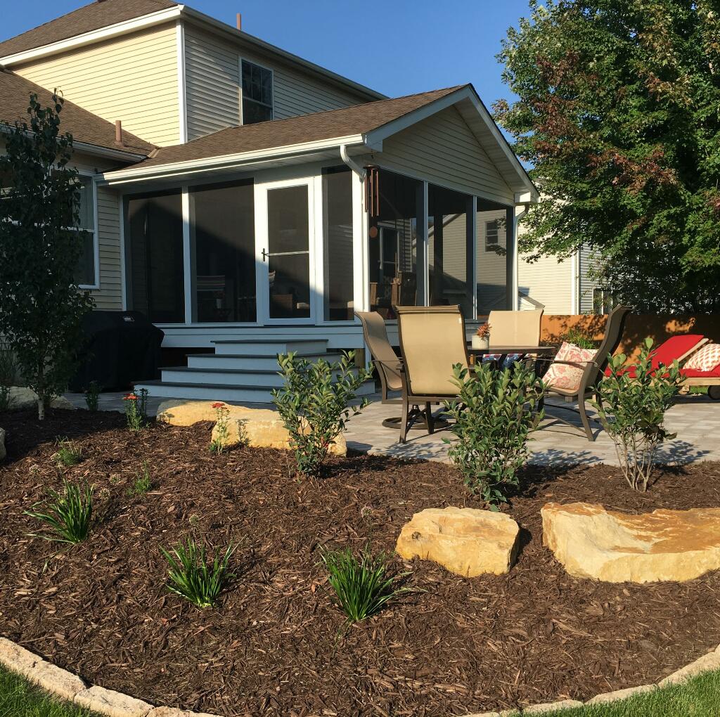 boulder walls with patio, seating area, plantings, rock bed by Sequoia Landscape