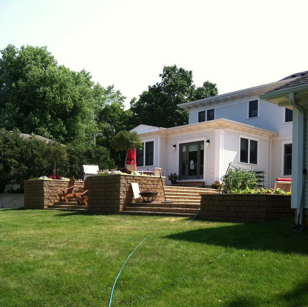 backyard stone patio and retaining wall by Sequoia Landscape