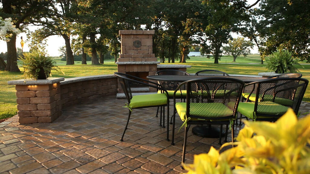 Outdoor Dining Area With Fireplace by Sequoia Landscape