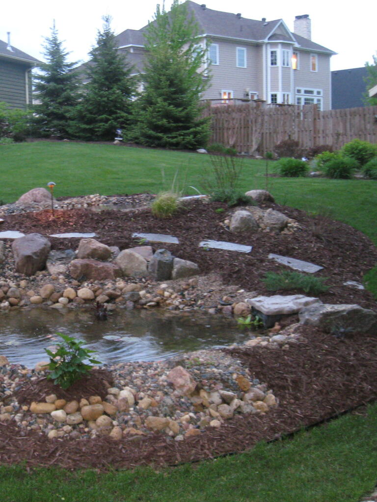Stepping Stone Path Around Pond by Sequoia Landscape